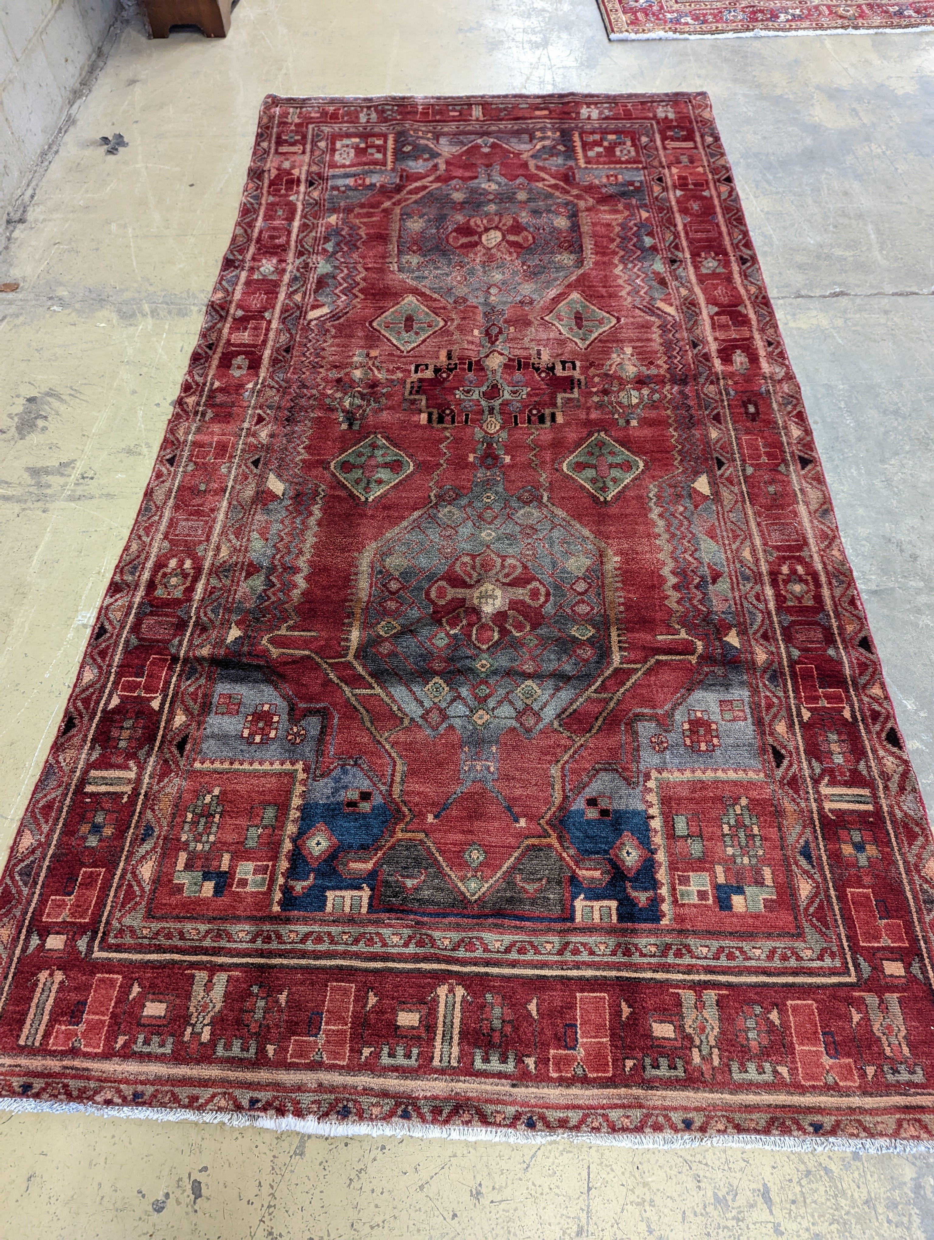 An Ardabil red ground carpet, 322 x 157cm